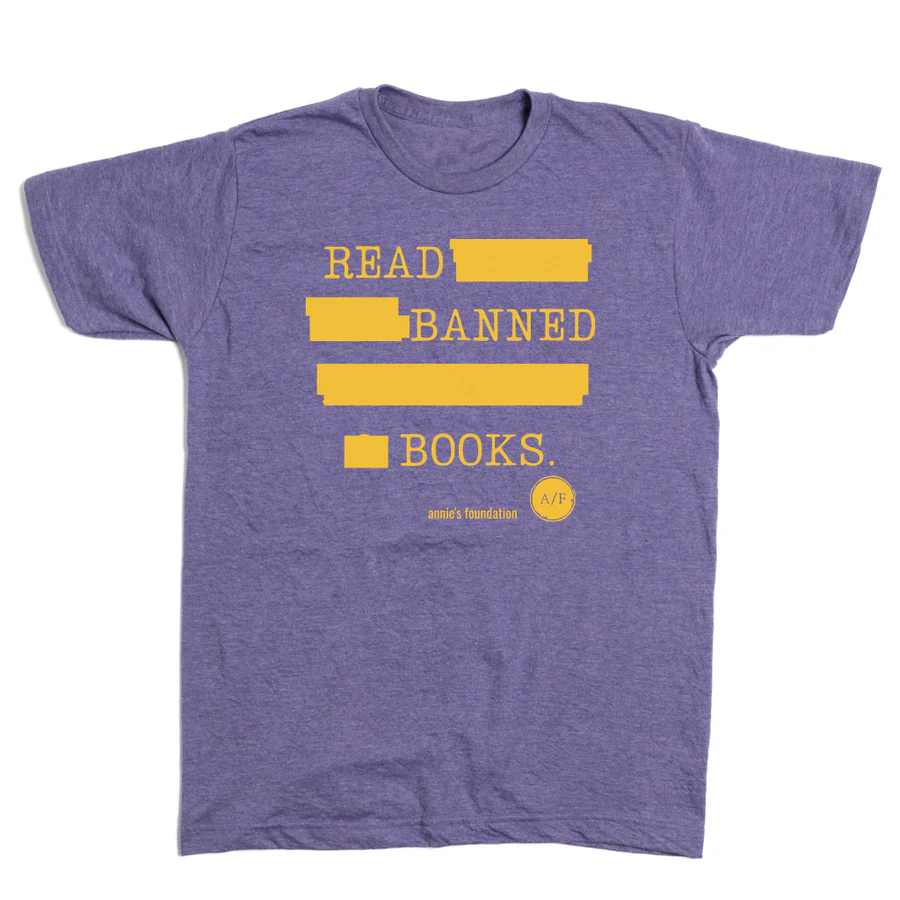 Purple shirt with yellow writing